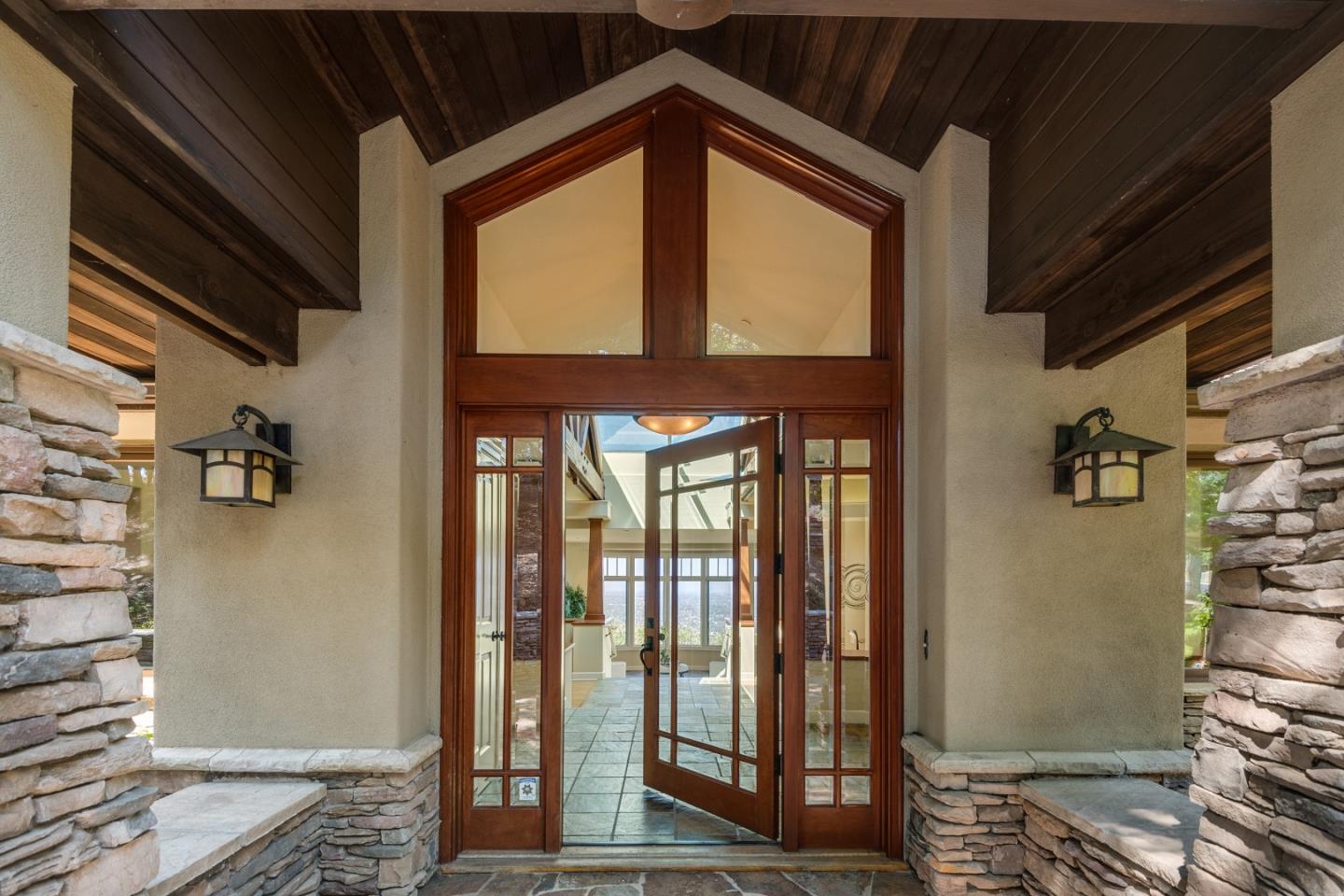 1795 Foster Road Los Gatos, CA 95030 - Photo 7 of 56 a view of a hallway with wooden floor and a living room