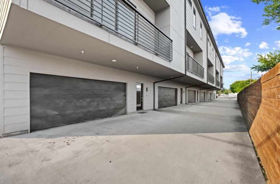 1715 Bennett Avenue, Unit 104 Dallas, TX 75206 - Photo 1 of 35 a view of a street with house