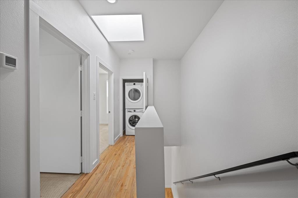 1715 Bennett Avenue, Unit 104 Dallas, TX 75206 - Photo 20 of 35 a bathroom with a sink and washing machine