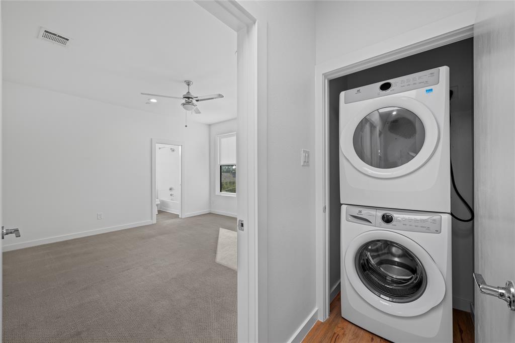 1715 Bennett Avenue, Unit 104 Dallas, TX 75206 - Photo 25 of 35 a view of a hallway with washer and dryer