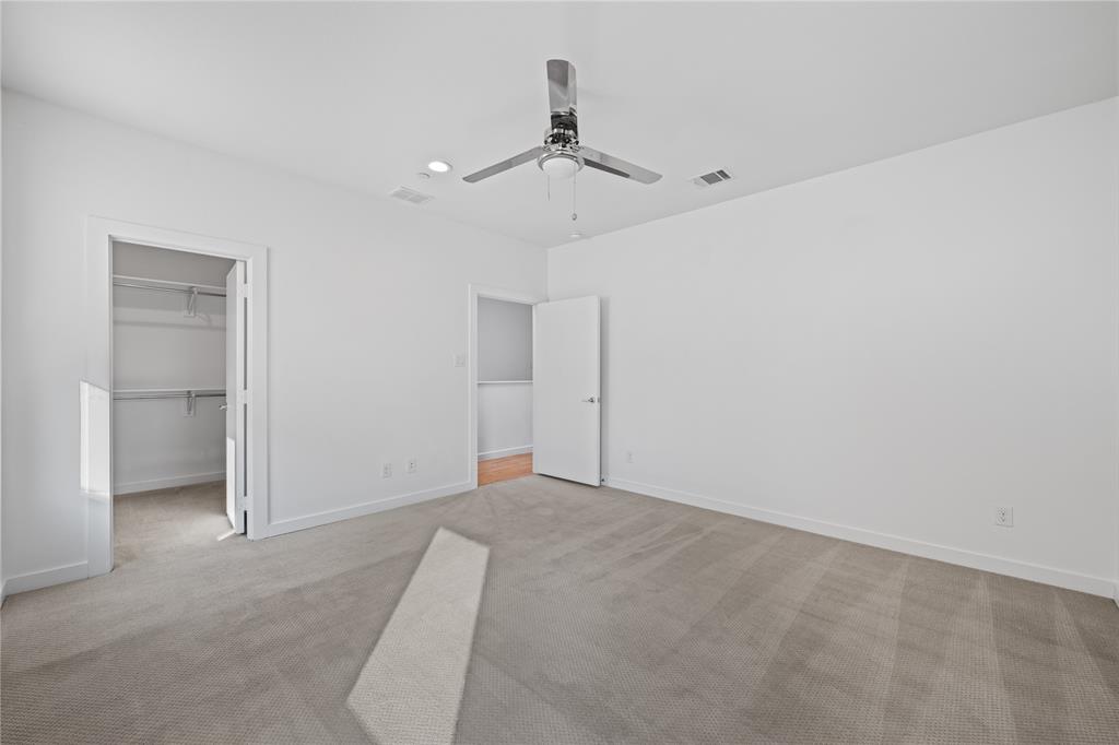 1715 Bennett Avenue, Unit 104 Dallas, TX 75206 - Photo 27 of 35 a view of an empty room with a ceiling fan