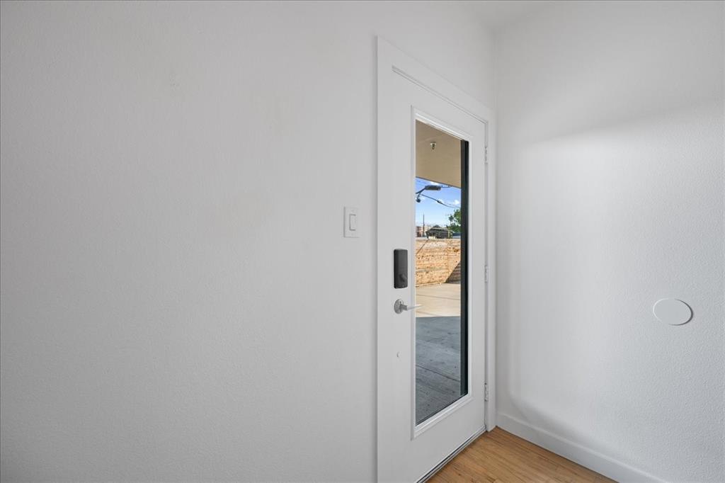 1715 Bennett Avenue, Unit 104 Dallas, TX 75206 - Photo 3 of 35 a view of a bathroom from a hallway