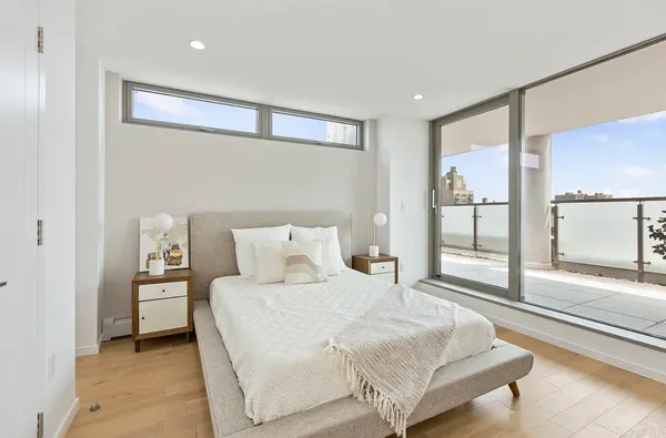 a kitchen with stainless steel appliances granite countertop a stove a refrigerator a sink a table and chairs