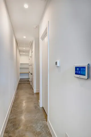 a kitchen with stainless steel appliances granite countertop a sink a counter space a stove and a window