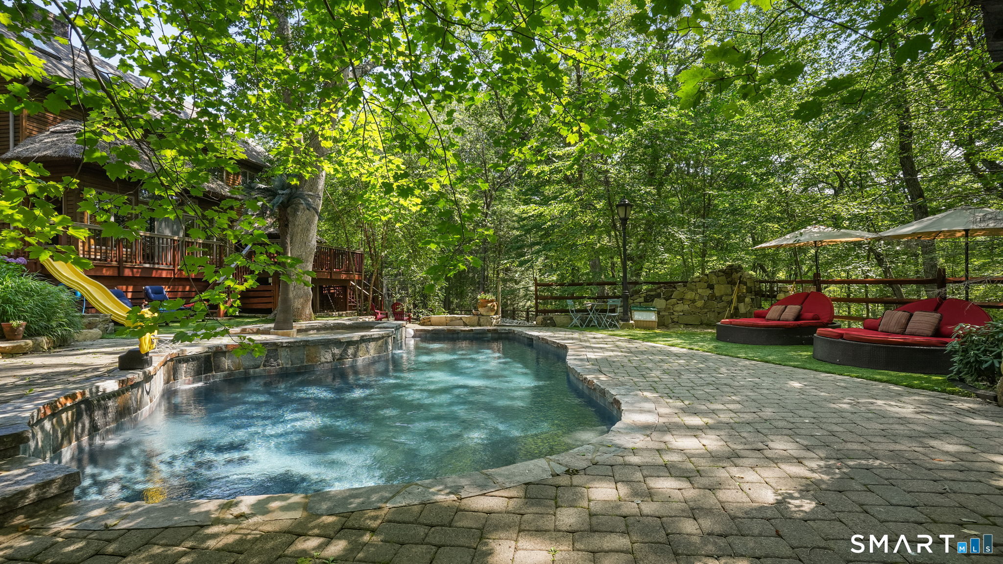 142 Seventy Acre Road Redding, CT 06896 - Photo 23 of 40 a view of a swimming pool with a patio