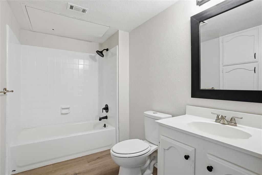 403 Redbud Drive Forney, TX 75126 - Photo 15 of 17 a bathroom with a granite countertop sink toilet and shower