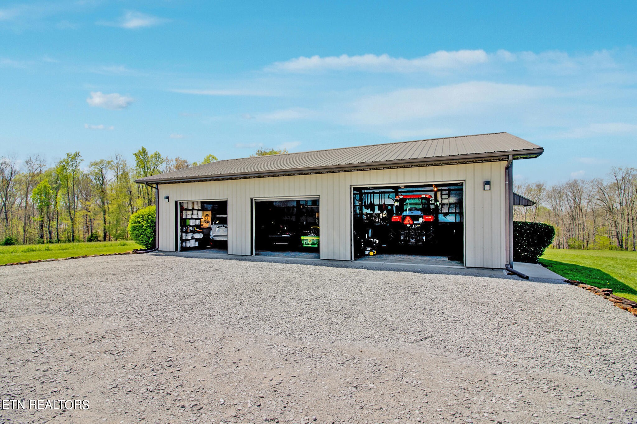 1471 Keyes Road Crossville, TN 38571 - Photo 54 of 59 a view of a house with a yard and a garage