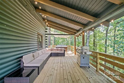 a view of balcony with couch and wooden floor