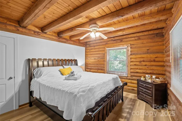 a bedroom with a bed and a table