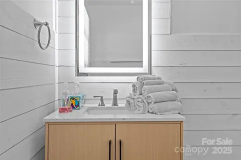 a bathroom with a sink and vanity