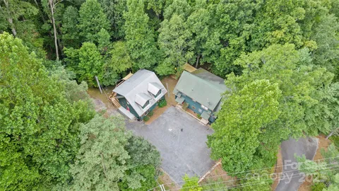 an aerial view of a house with a yard and garden view