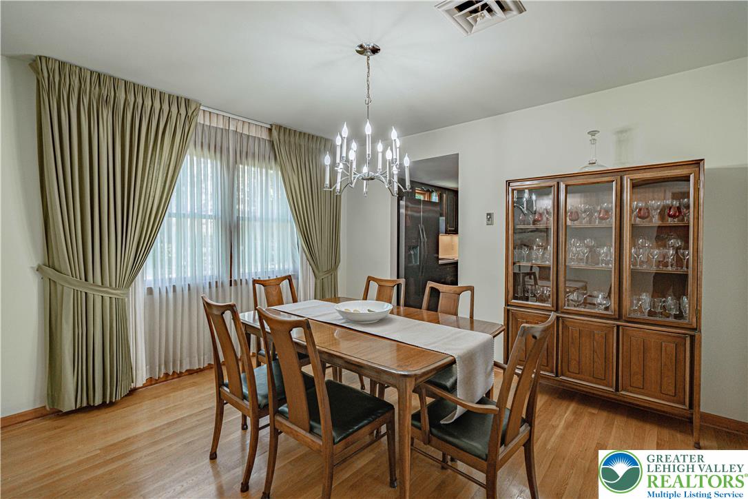 3045 Rambeau Road Bethlehem, PA 18020 - Photo 12 of 52 a view of a dining room with furniture window and wooden floor