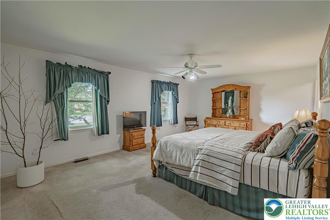 3045 Rambeau Road Bethlehem, PA 18020 - Photo 15 of 52 a bedroom with a large bed and windows