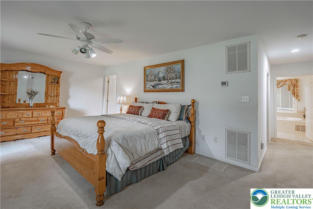 3045 Rambeau Road Bethlehem, PA 18020 - Photo 16 of 52 a spacious bedroom with a bed and a dresser