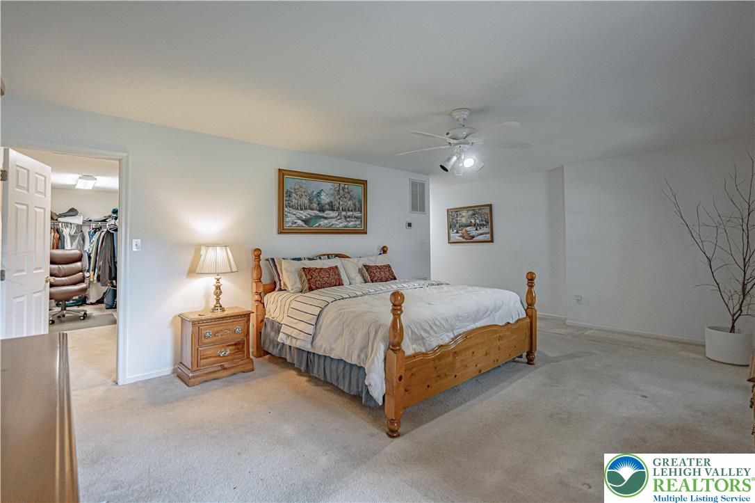 3045 Rambeau Road Bethlehem, PA 18020 - Photo 17 of 52 a bedroom with a bed and a painting on the wall