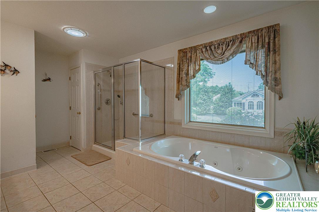 3045 Rambeau Road Bethlehem, PA 18020 - Photo 21 of 52 a bathroom with a bathtub and a shower