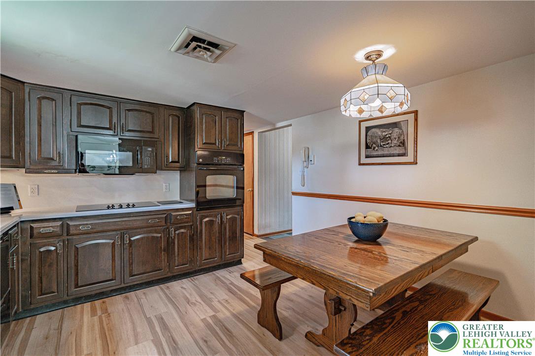 3045 Rambeau Road Bethlehem, PA 18020 - Photo 22 of 52 a kitchen with a sink cabinets and wooden floor