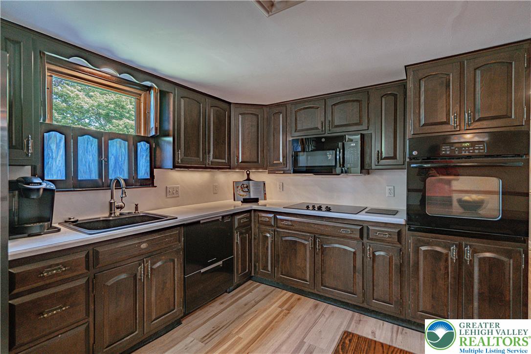3045 Rambeau Road Bethlehem, PA 18020 - Photo 23 of 52 a kitchen with a sink stove and cabinets