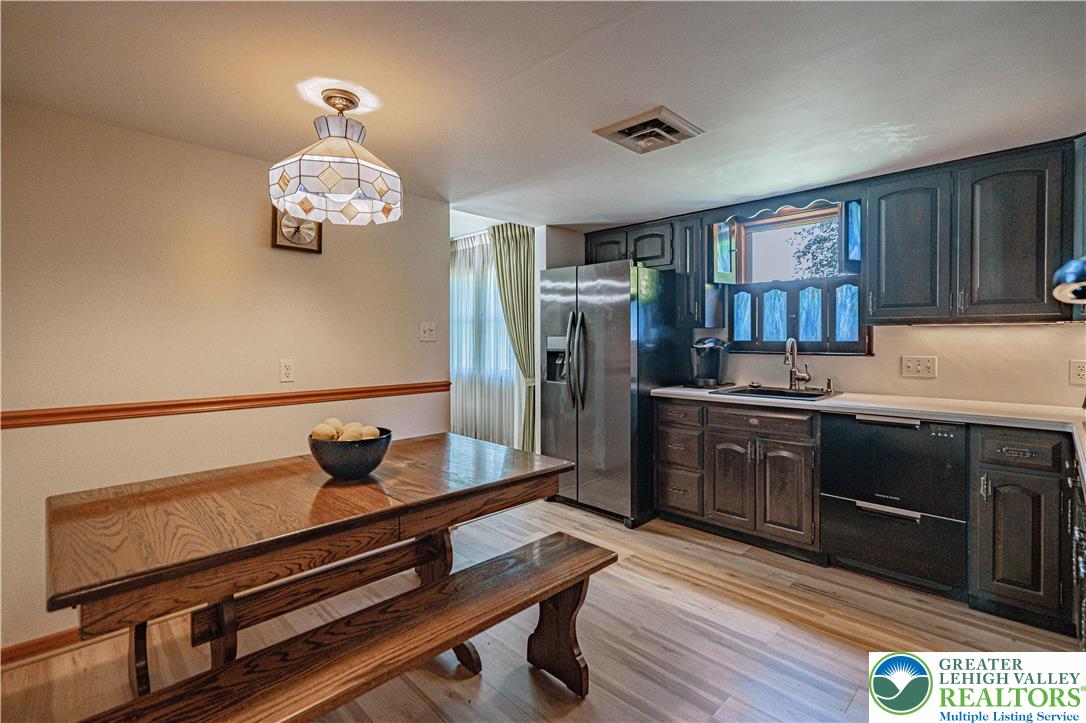 3045 Rambeau Road Bethlehem, PA 18020 - Photo 25 of 52 a kitchen with a refrigerator and a stove top oven