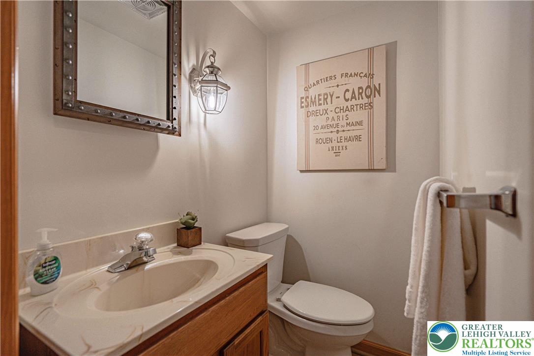 3045 Rambeau Road Bethlehem, PA 18020 - Photo 26 of 52 a bathroom with a sink a toilet and a mirror
