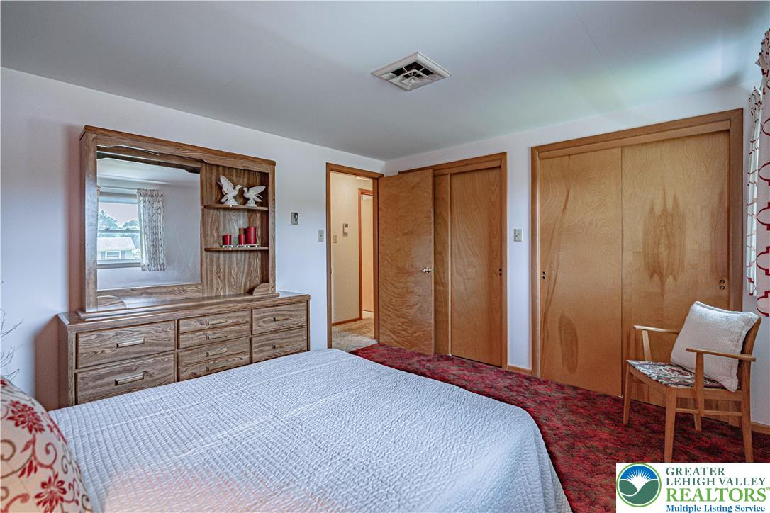3045 Rambeau Road Bethlehem, PA 18020 - Photo 37 of 52 a bedroom with a bed and furniture with mirror