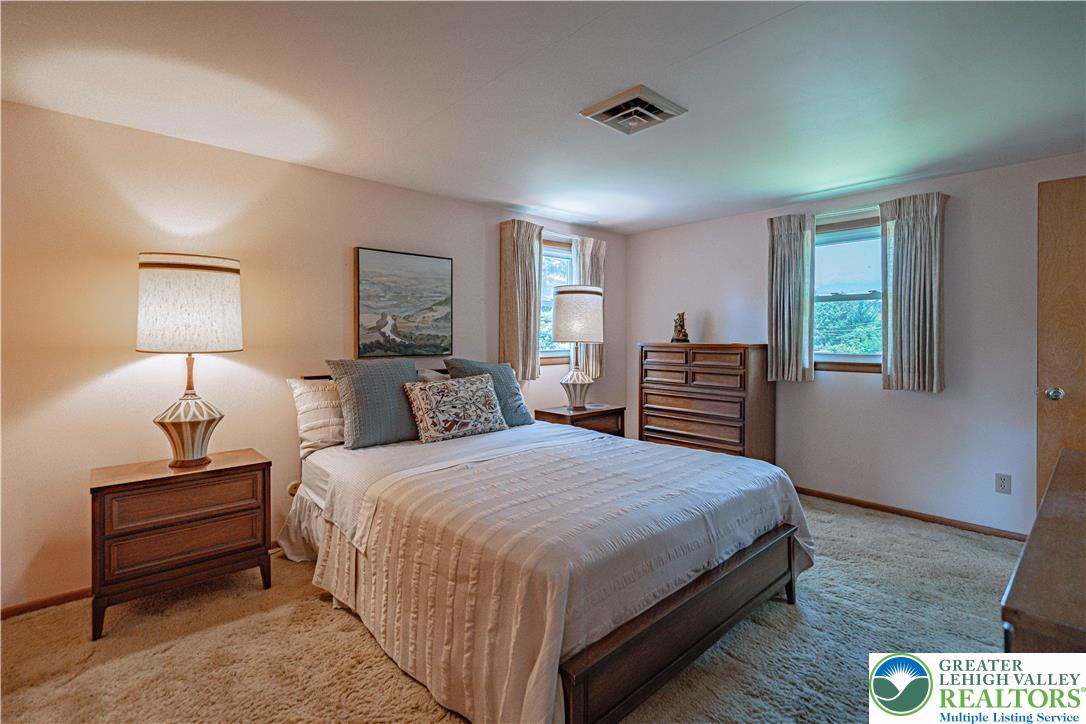 3045 Rambeau Road Bethlehem, PA 18020 - Photo 38 of 52 a bedroom with a bed and wooden floor