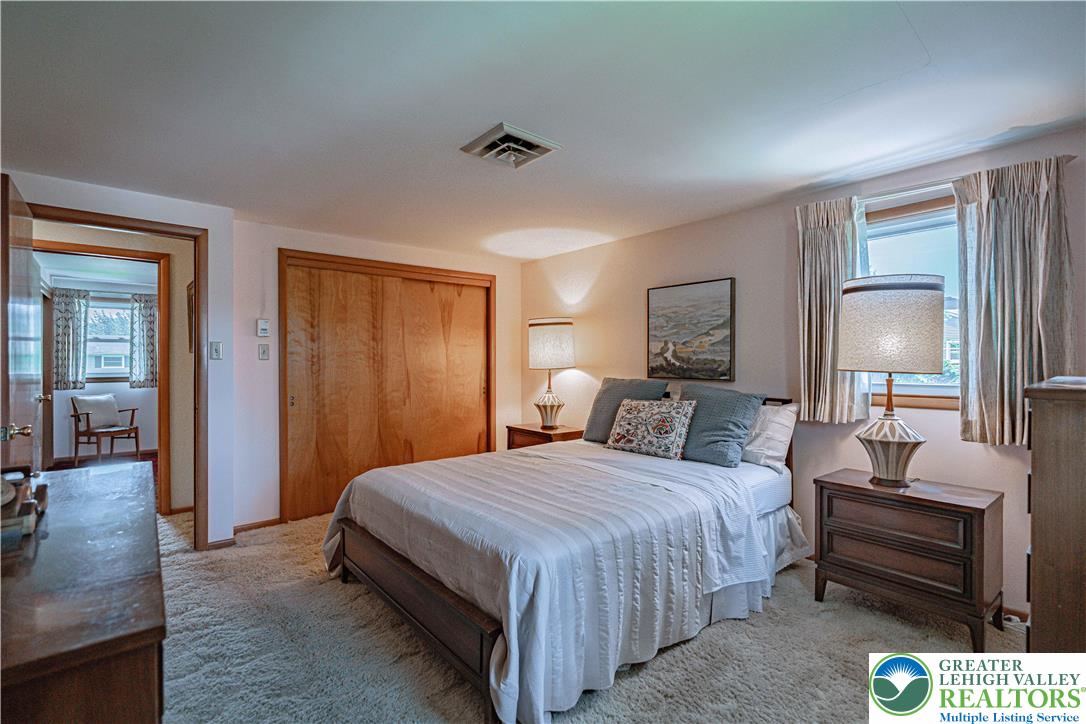 3045 Rambeau Road Bethlehem, PA 18020 - Photo 40 of 52 a bedroom with a bed and lamp on dresser