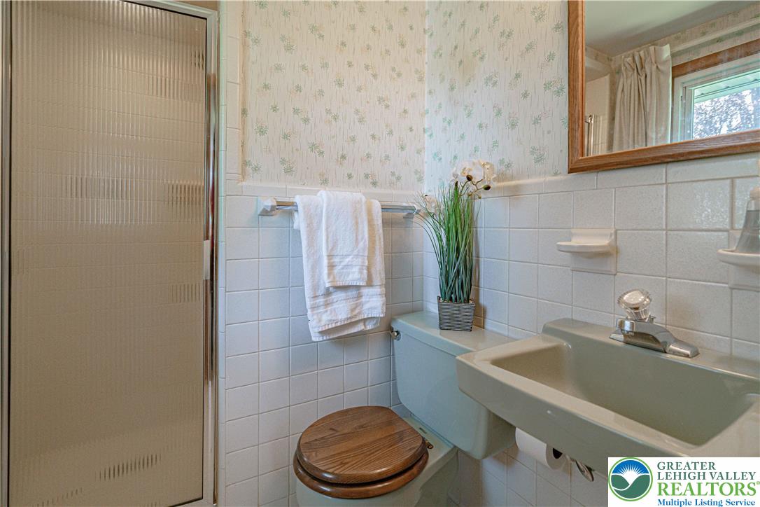 3045 Rambeau Road Bethlehem, PA 18020 - Photo 41 of 52 a bathroom with a sink a toilet and a mirror