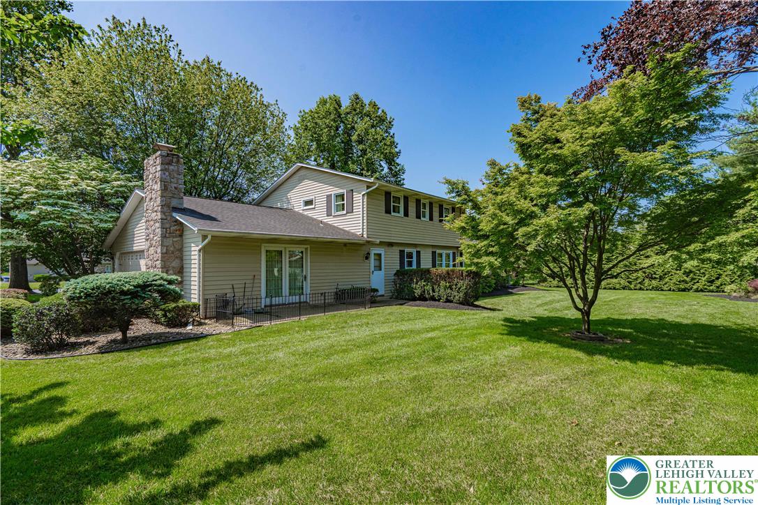 3045 Rambeau Road Bethlehem, PA 18020 - Photo 45 of 52 a front view of a house with a yard and trees