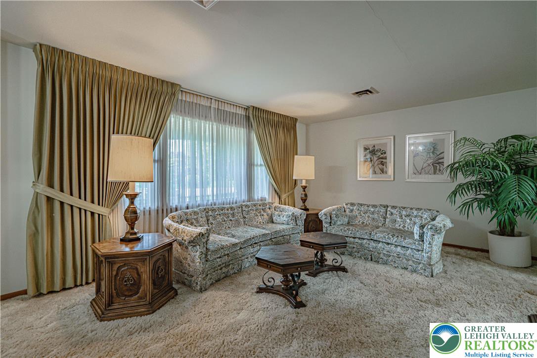 3045 Rambeau Road Bethlehem, PA 18020 - Photo 9 of 52 a living room with furniture and a potted plant