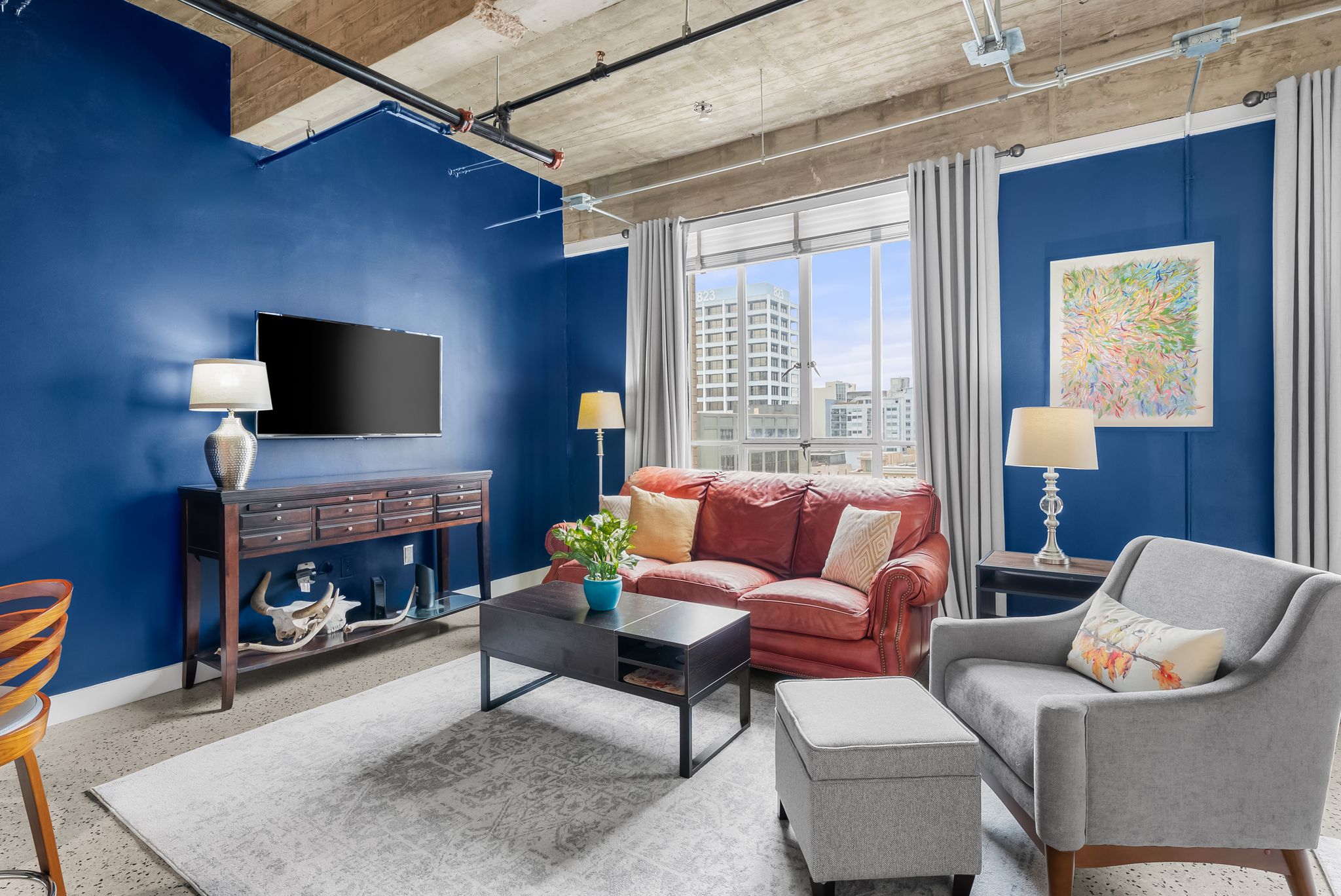 710 Colorado Street, Unit 6E Austin, TX 78701 - Photo 7 of 24 City views and exposed ceilings define this chic, vibrant living area.