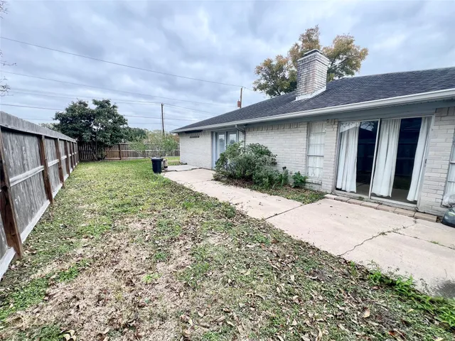 a view of a backyard of the house
