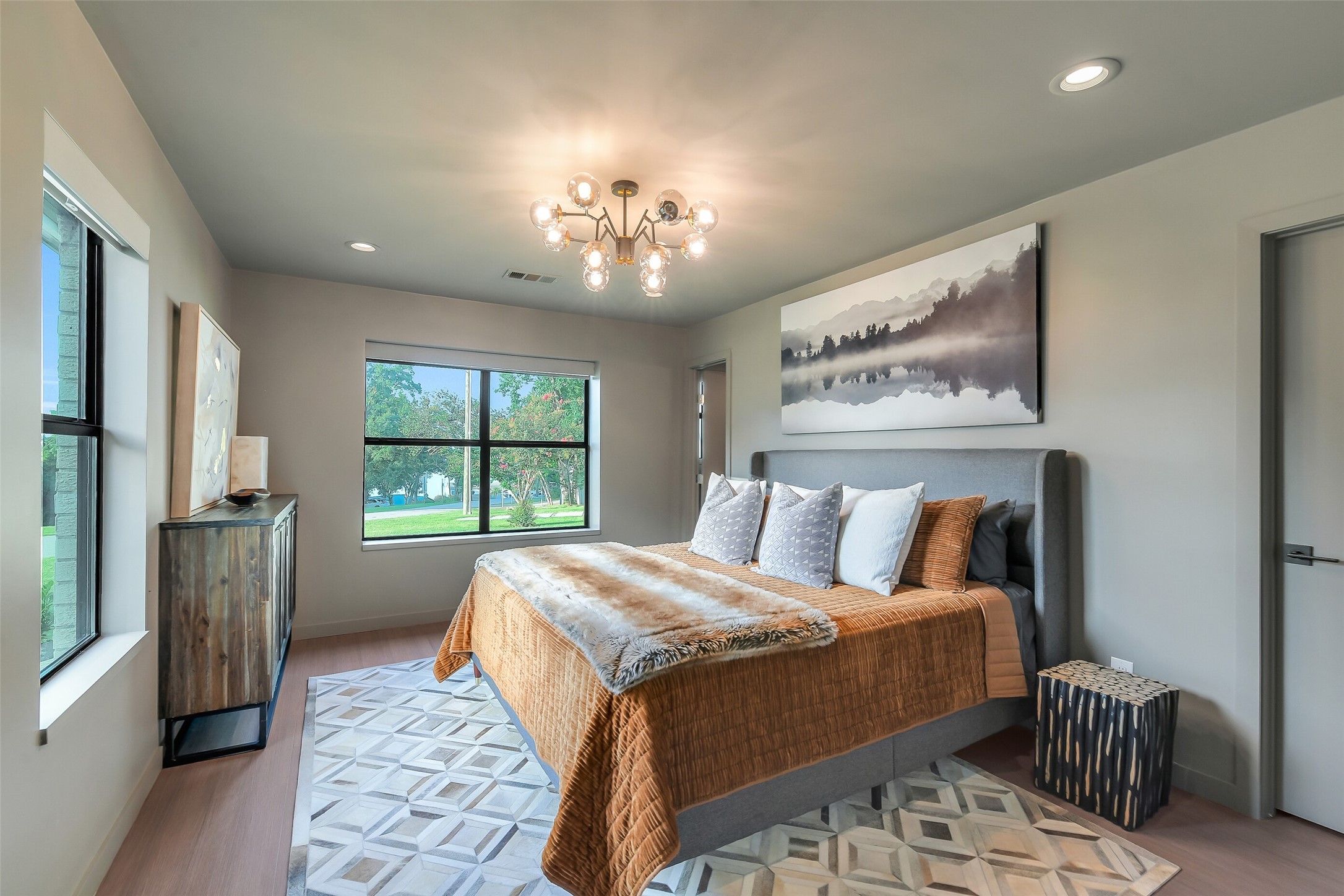 0 Camilla Lake Road Coldspring, TX 77331 - Photo 19 of 50 Brick House: The primary suite with a lake view invites you in with abundant natural light and a relaxed, luxurious contemporary feel that includes an en-suite bathroom and walk-in closet.