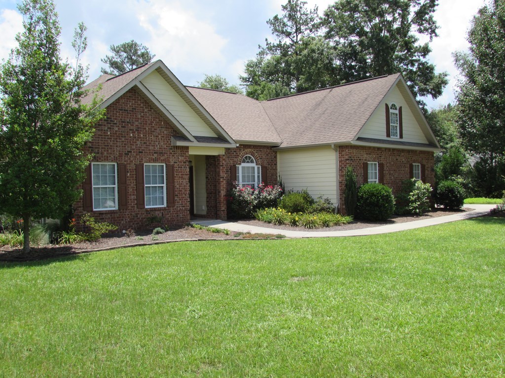 7440 Goodall Mill Road Macon, GA 31216 - Photo 2 of 33 a front view of a house with a yard and garage