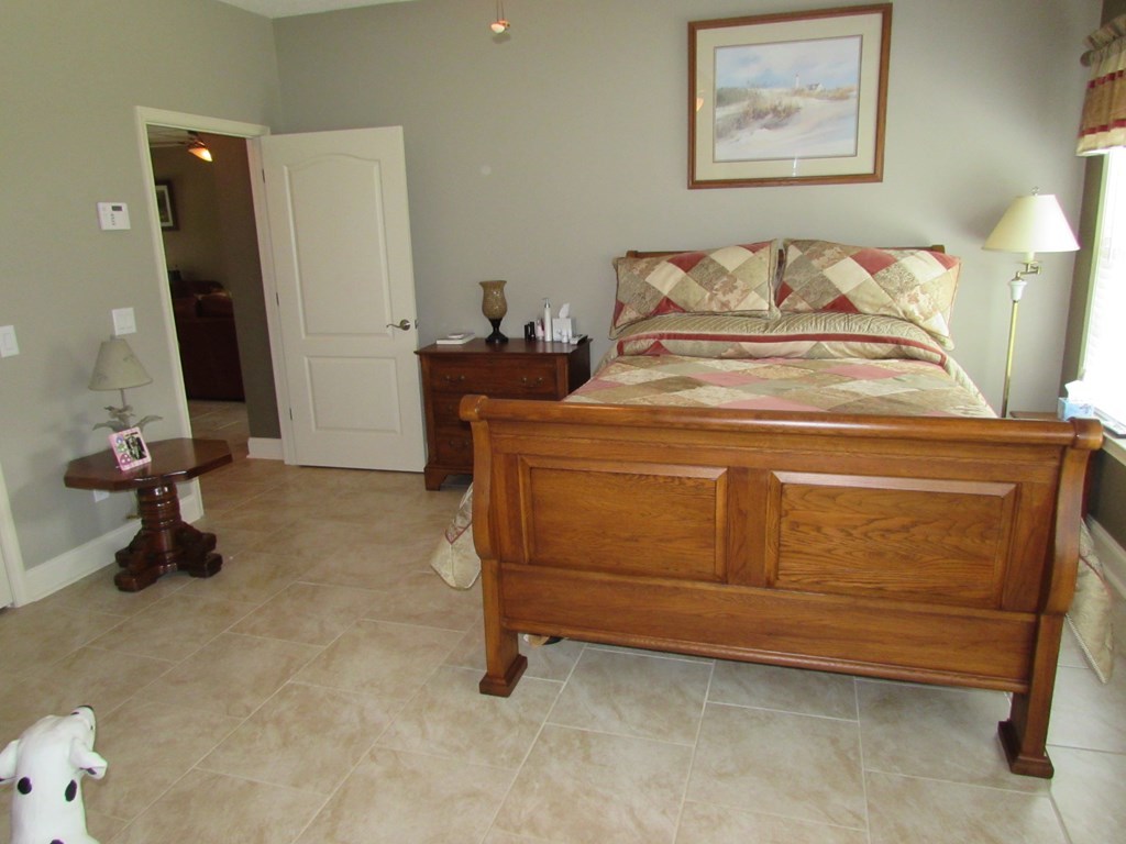 7440 Goodall Mill Road Macon, GA 31216 - Photo 17 of 33 a bed room with a bed and a television