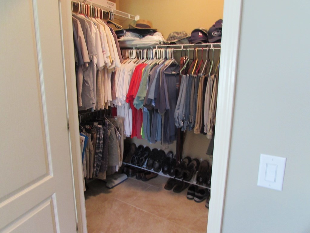 7440 Goodall Mill Road Macon, GA 31216 - Photo 19 of 33 a view of walk in closet with clothes and shoes