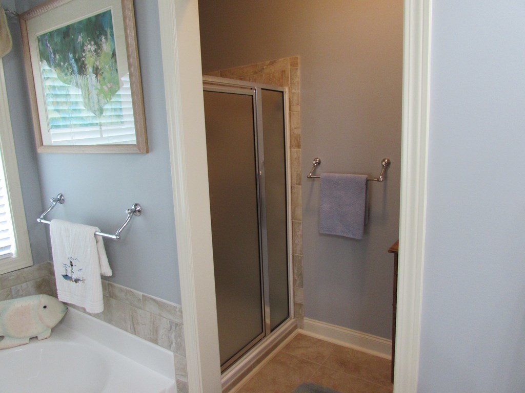 7440 Goodall Mill Road Macon, GA 31216 - Photo 21 of 33 a bathroom with a toilet and a shower