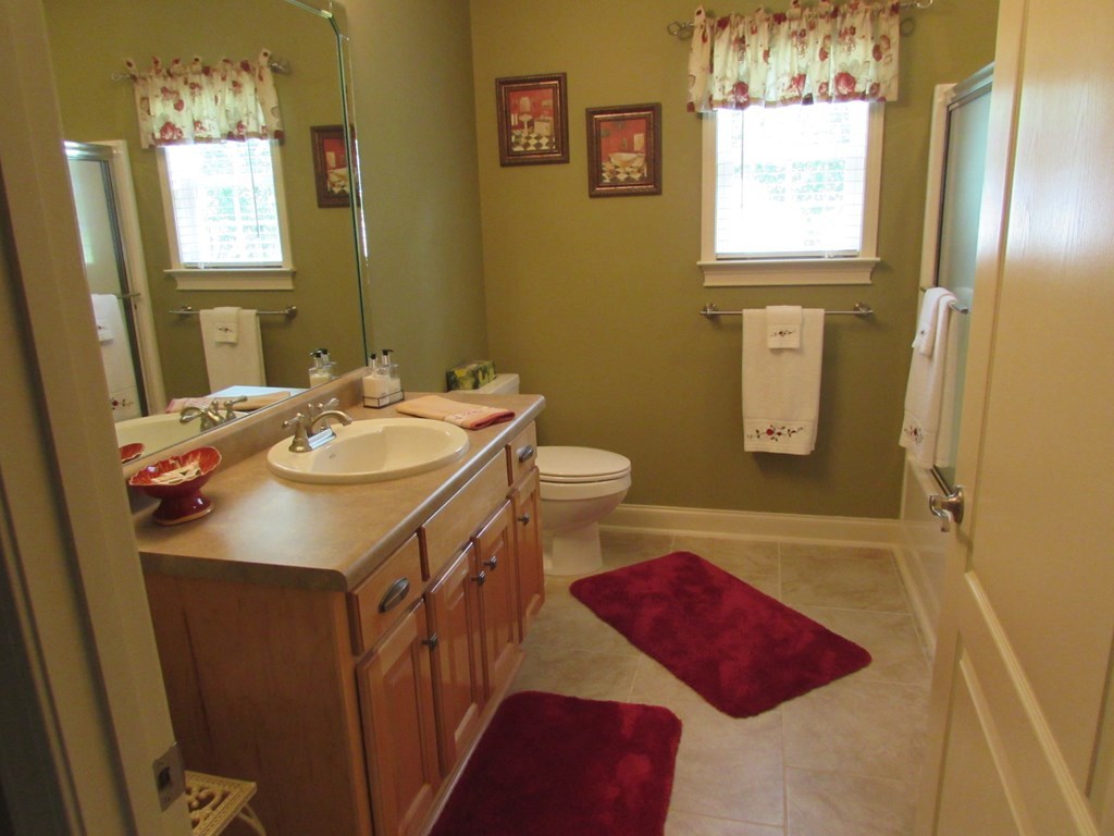 7440 Goodall Mill Road Macon, GA 31216 - Photo 25 of 33 a bathroom with a sink and a mirror