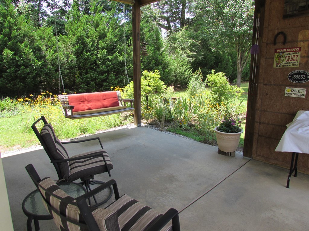 7440 Goodall Mill Road Macon, GA 31216 - Photo 29 of 33 a view of a chairs and table in backyard