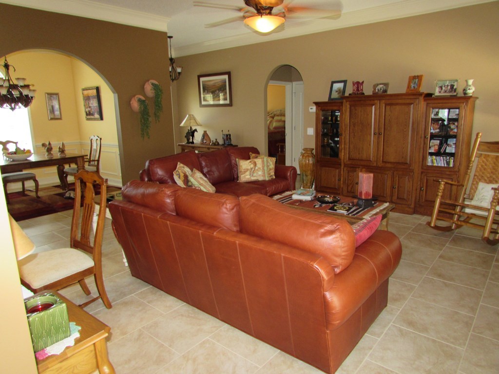 7440 Goodall Mill Road Macon, GA 31216 - Photo 8 of 33 a living room with furniture a ceiling fan and a window