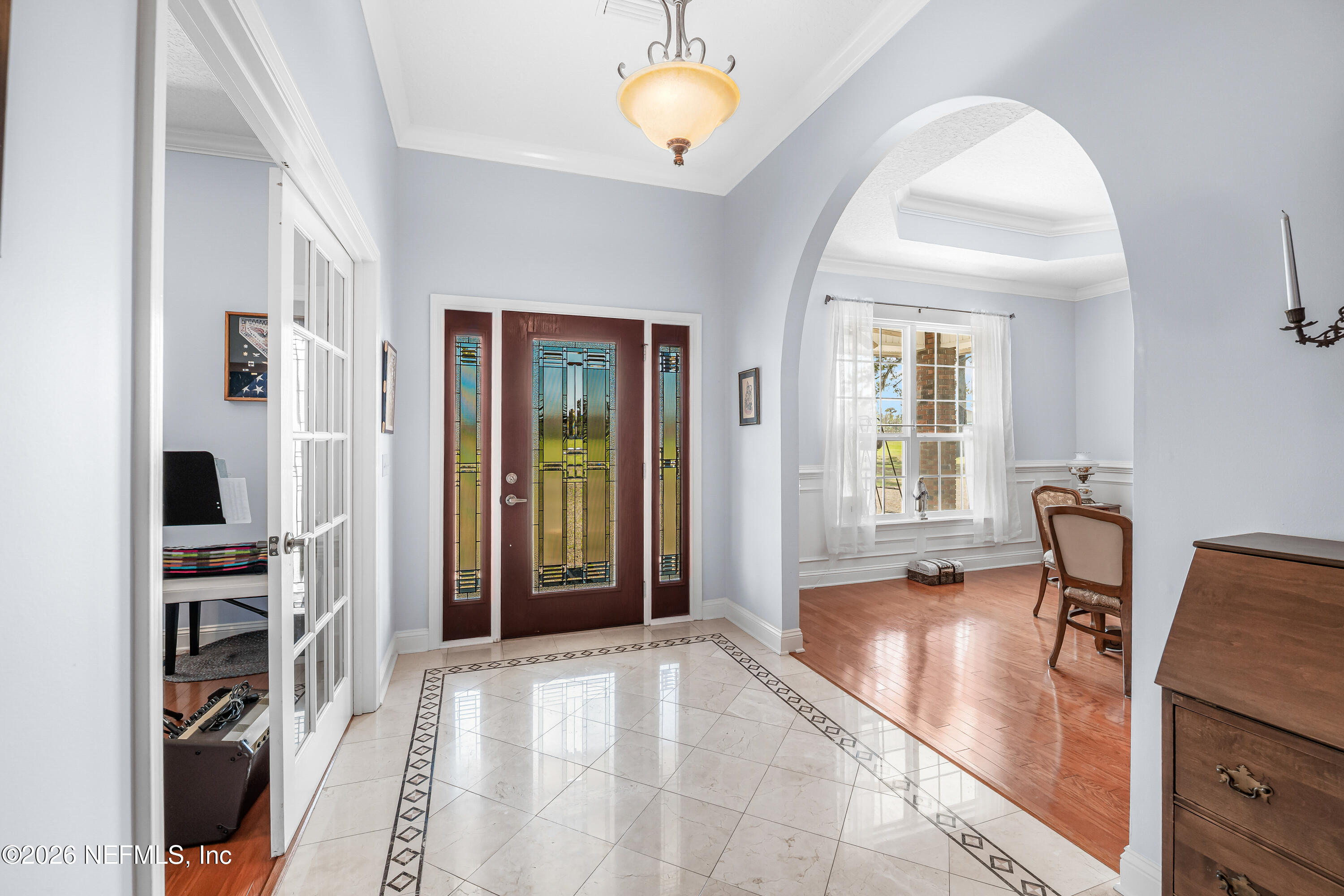 371154 Kings Ferry Road Hilliard, FL 32046 - Photo 13 of 65 a view of a livingroom with furniture and a window
