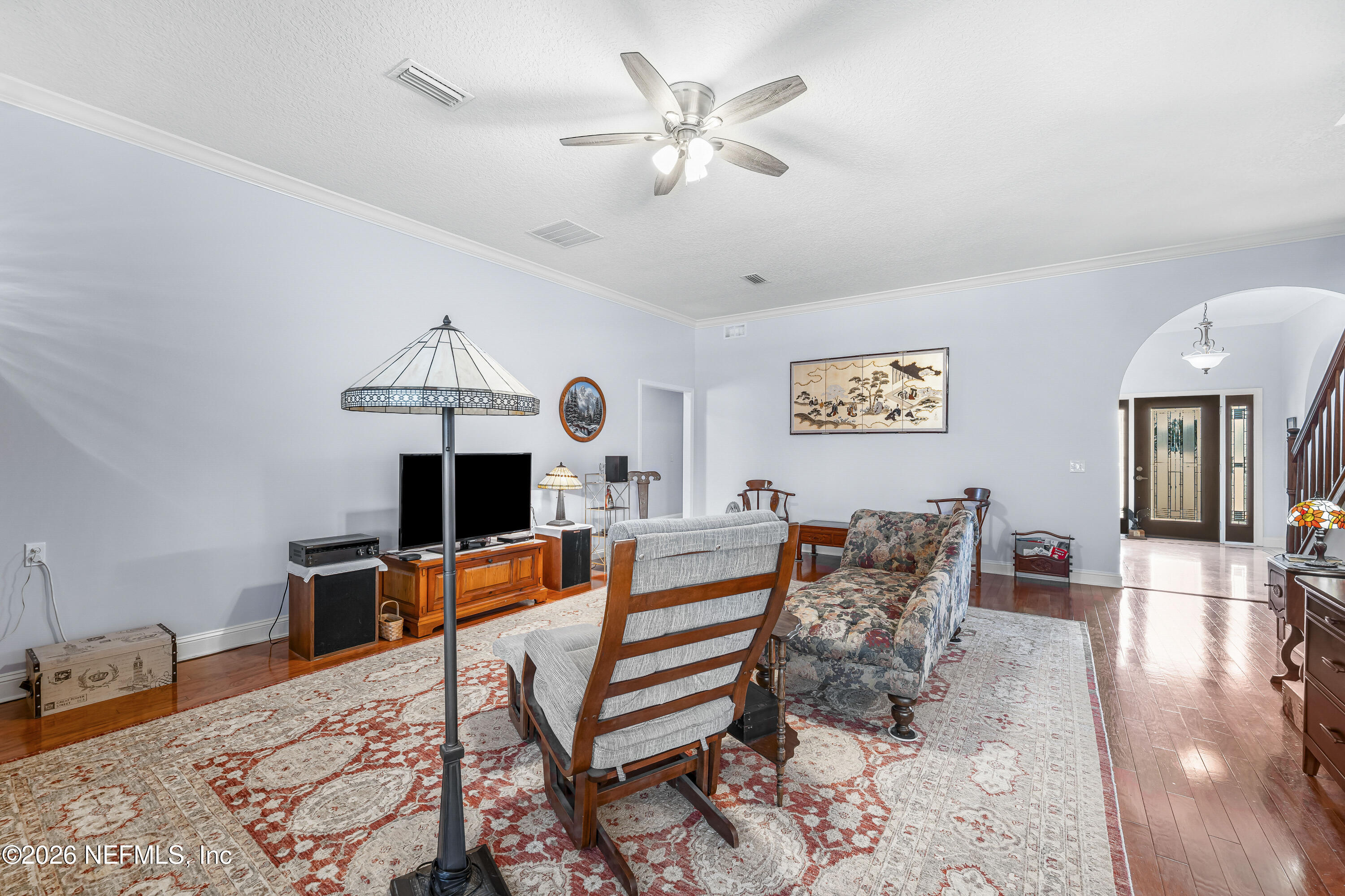 371154 Kings Ferry Road Hilliard, FL 32046 - Photo 19 of 65 a living room with furniture and a chandelier