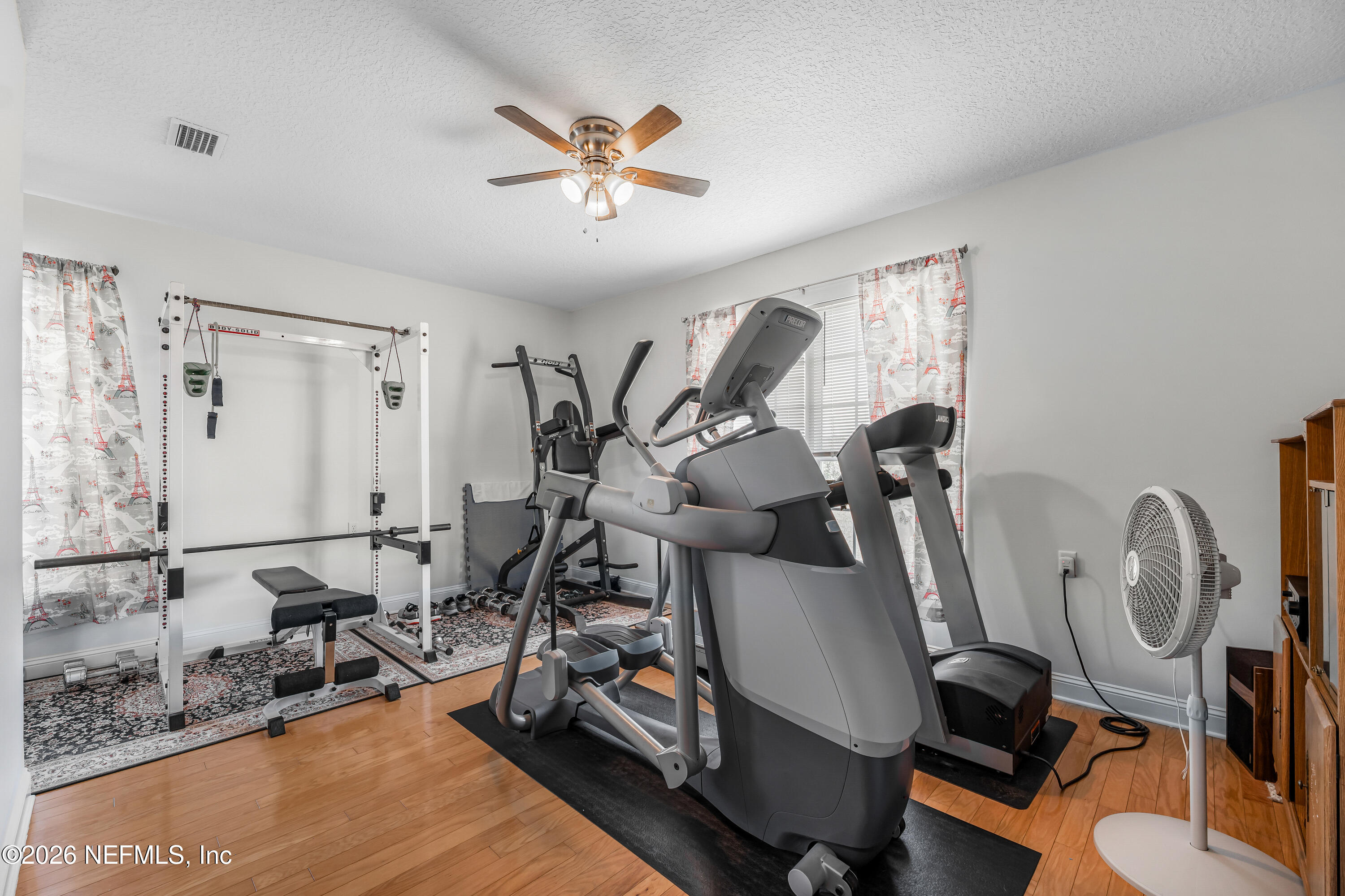 371154 Kings Ferry Road Hilliard, FL 32046 - Photo 21 of 65 a view of a room with gym equipment