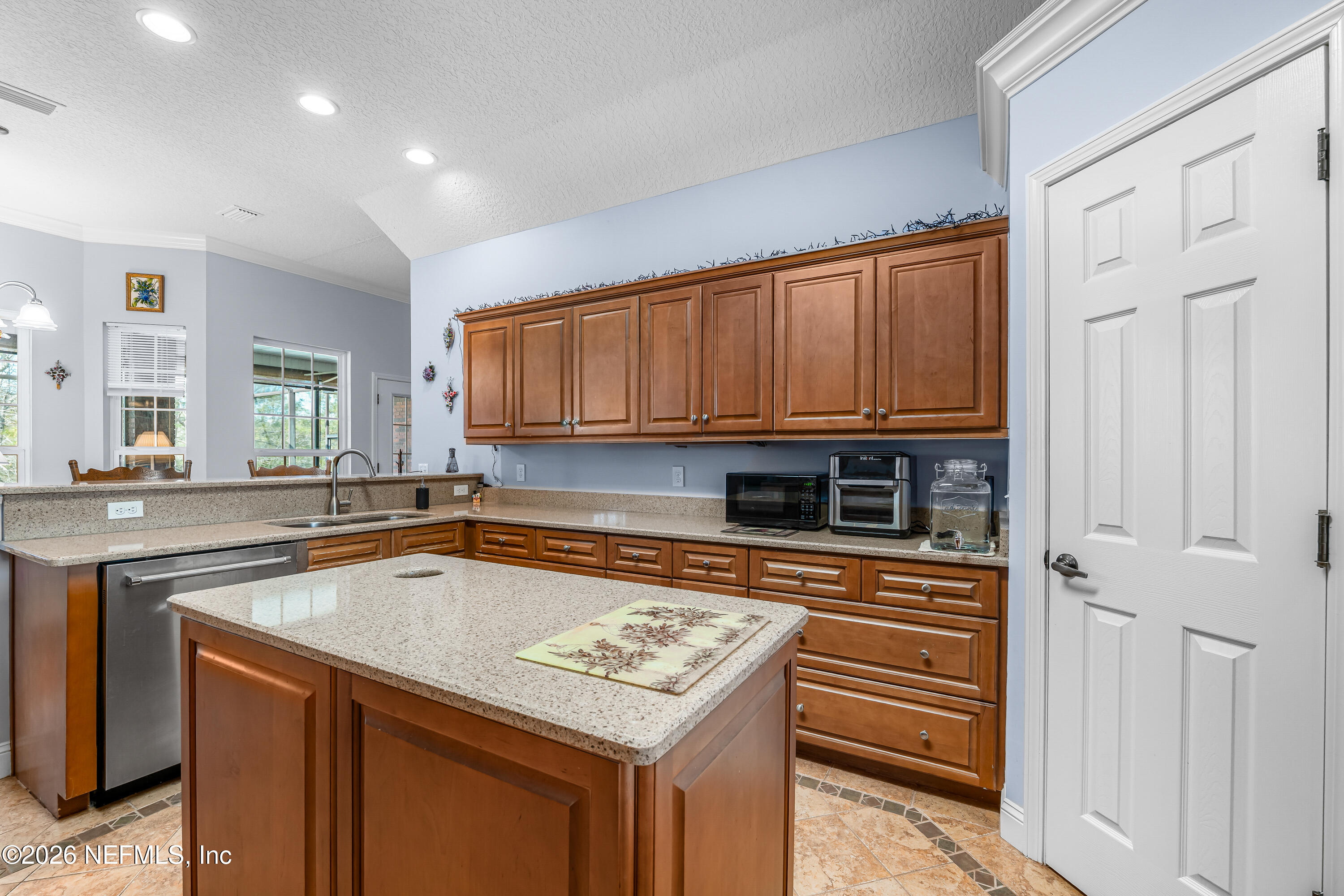 371154 Kings Ferry Road Hilliard, FL 32046 - Photo 35 of 65 a kitchen with a sink stove and cabinets