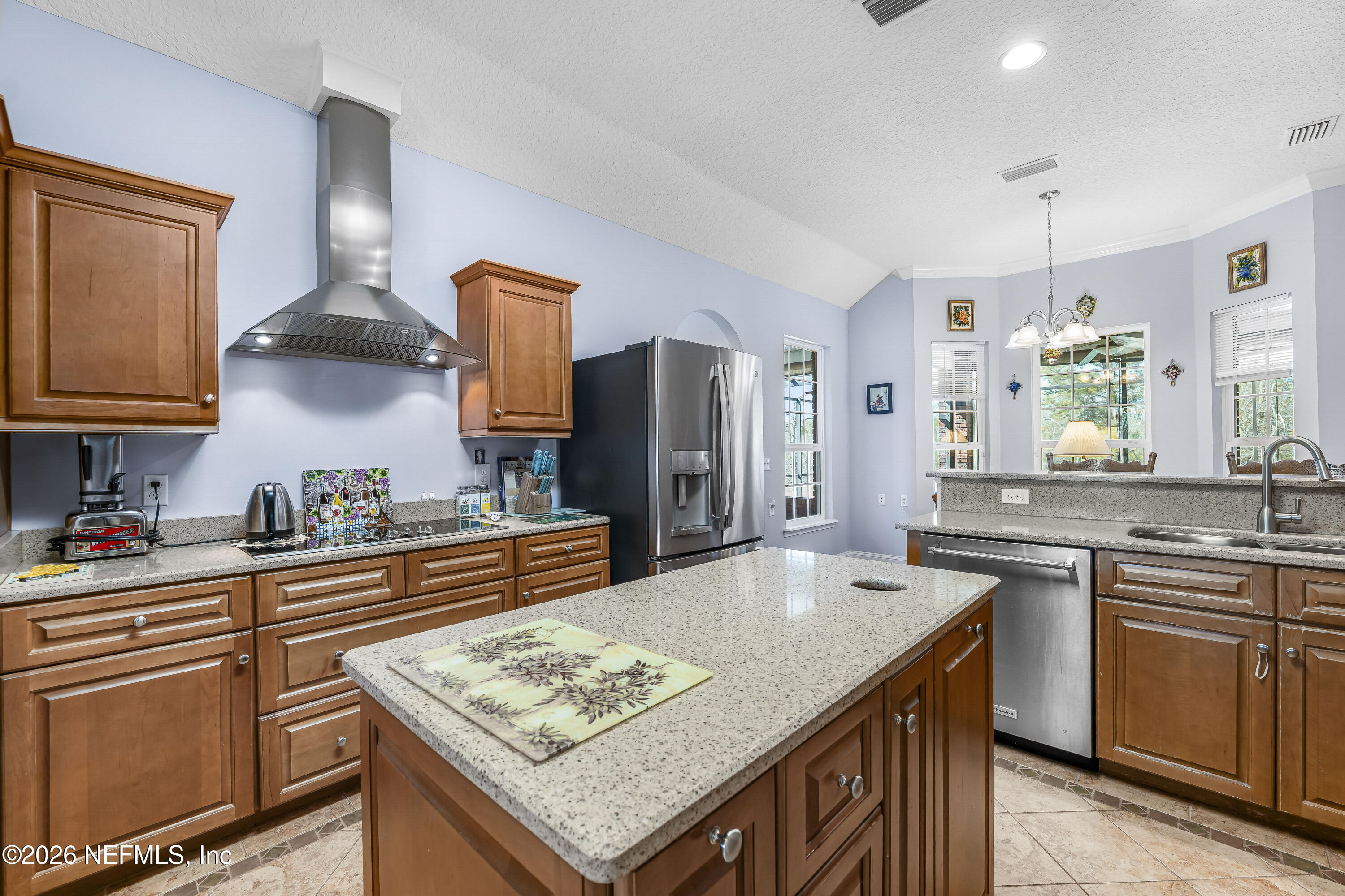 371154 Kings Ferry Road Hilliard, FL 32046 - Photo 36 of 65 a kitchen with stainless steel appliances granite countertop a sink stove and refrigerator