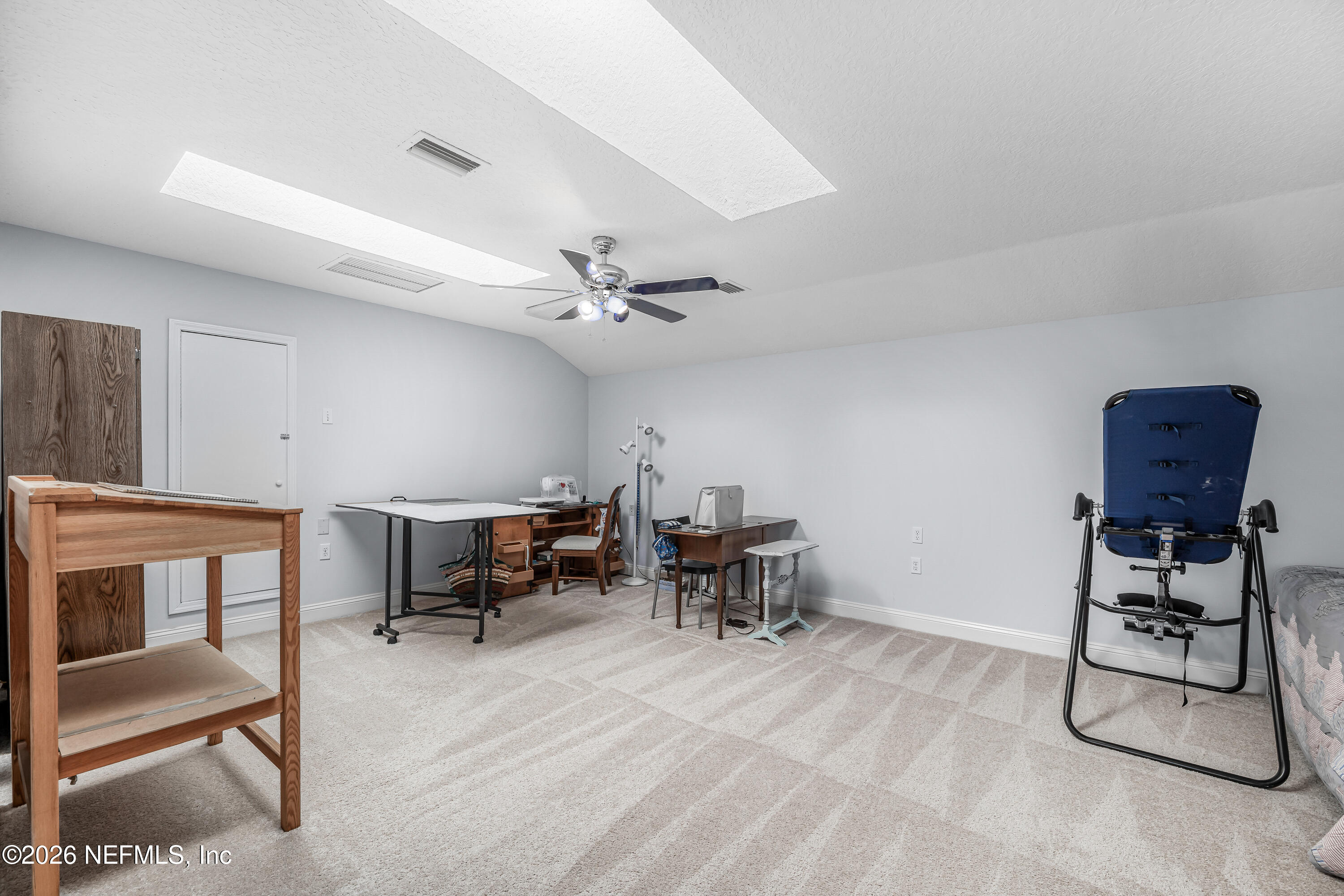 371154 Kings Ferry Road Hilliard, FL 32046 - Photo 40 of 65 a view of a workspace with furniture and a ceiling fan
