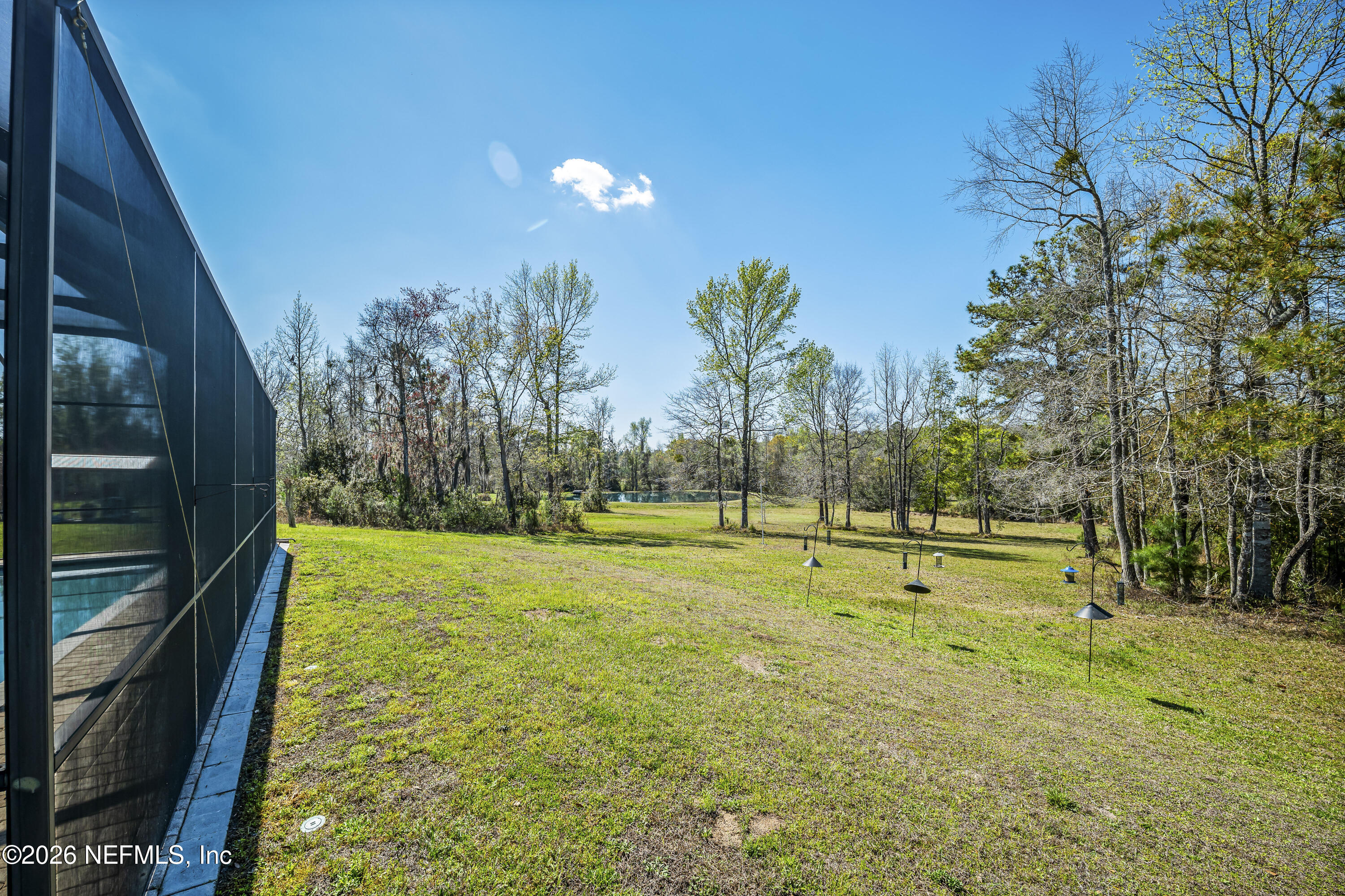 371154 Kings Ferry Road Hilliard, FL 32046 - Photo 50 of 65 a view of an outdoor space and swimming pool