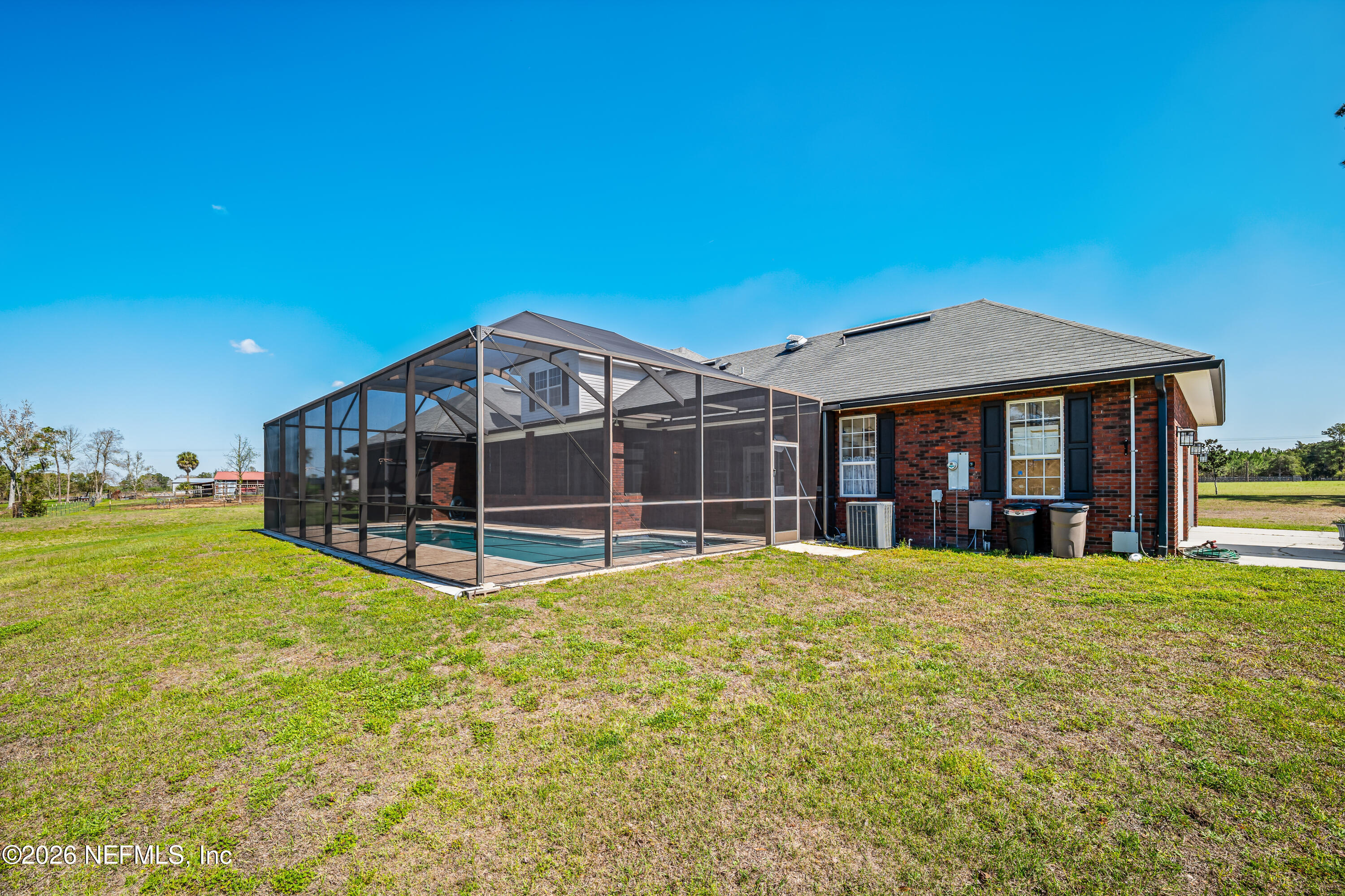 371154 Kings Ferry Road Hilliard, FL 32046 - Photo 51 of 65 a view of a house with a big yard and large trees