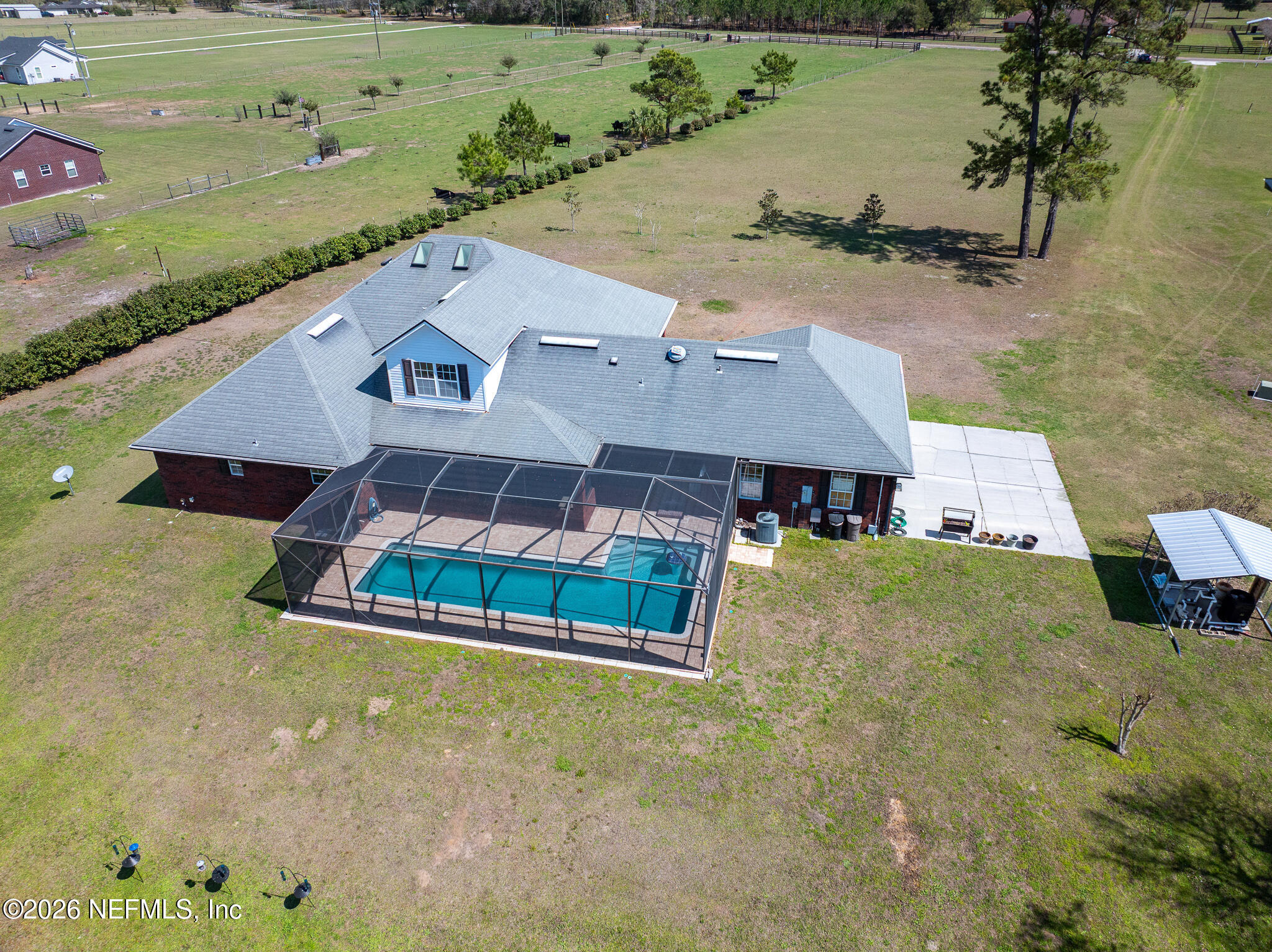 371154 Kings Ferry Road Hilliard, FL 32046 - Photo 53 of 65 an aerial view of a house with a yard and lake view