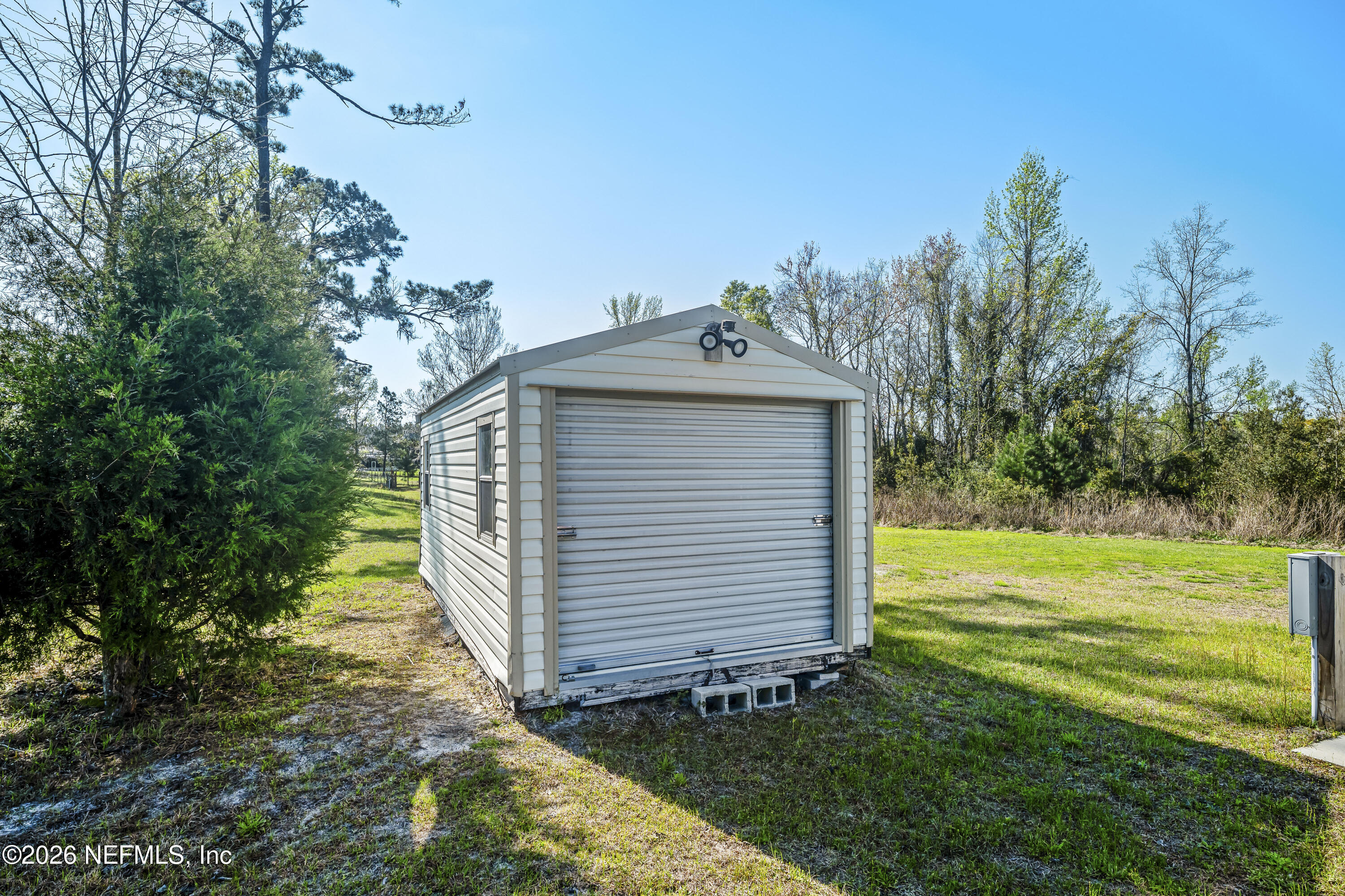 371154 Kings Ferry Road Hilliard, FL 32046 - Photo 58 of 65 a view of a house with a yard